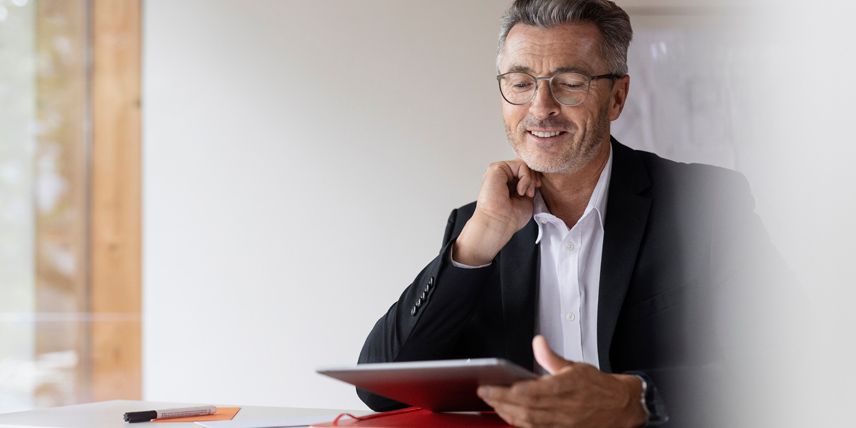 Man looking at tablet.