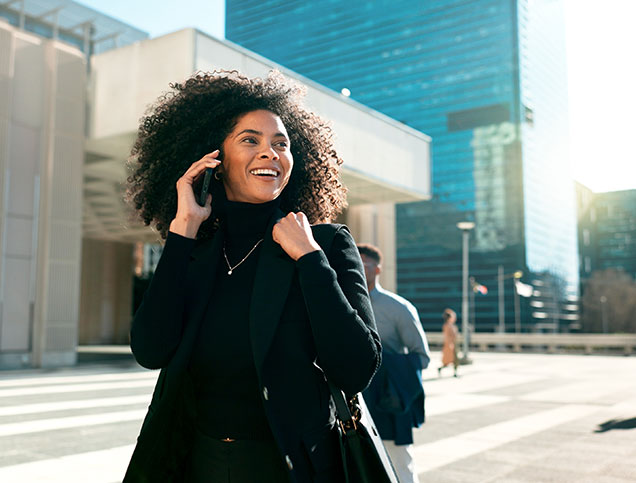 Walking, city or happy businesswoman on a phone call talking, networking or speaking in travel. Mobile communication, chat or biracial female entrepreneur in conversation, discussion or negotiation