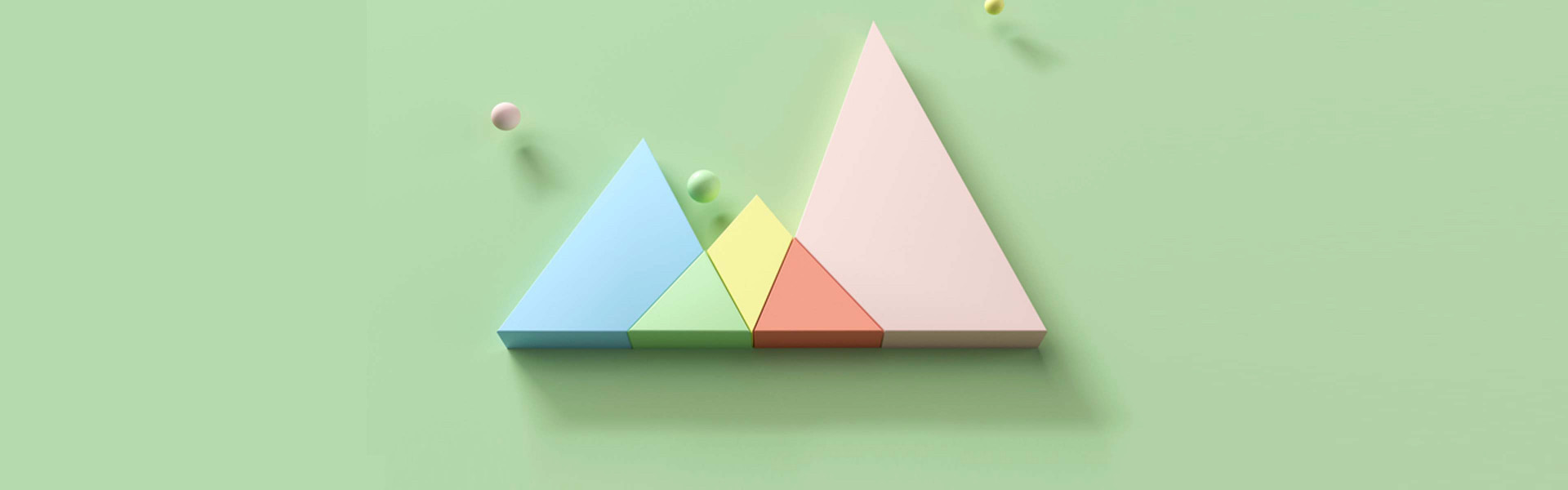 Colorful triangles on a green background with three small spheres.