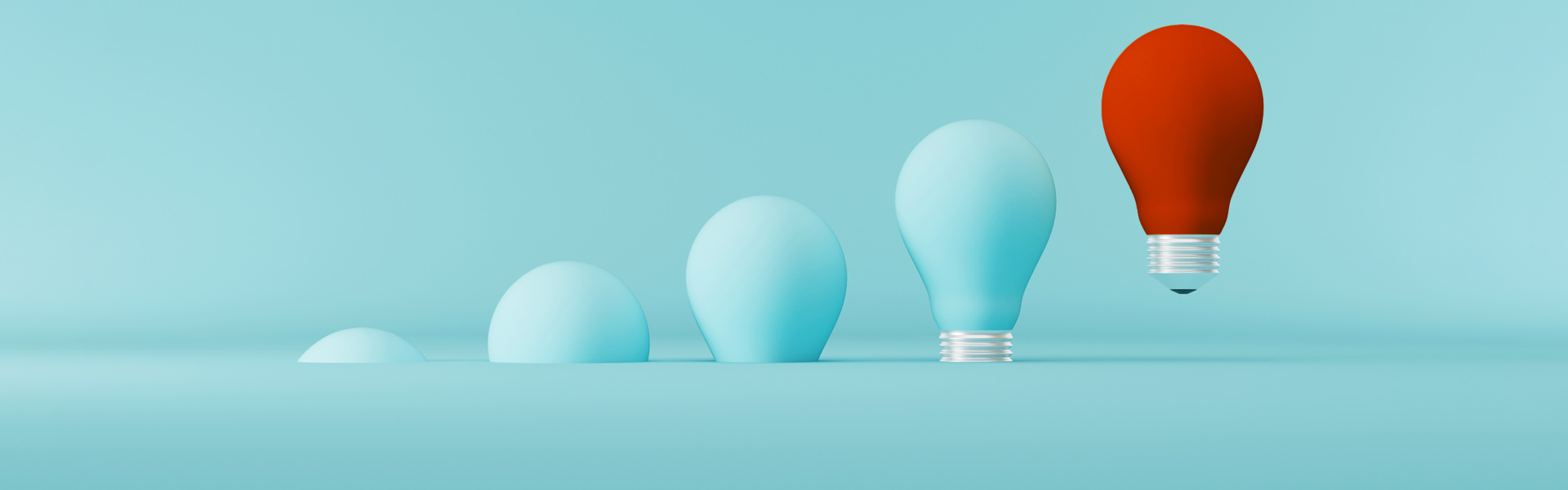 Red light bulb floating outstanding among other light bulbs on light blue background