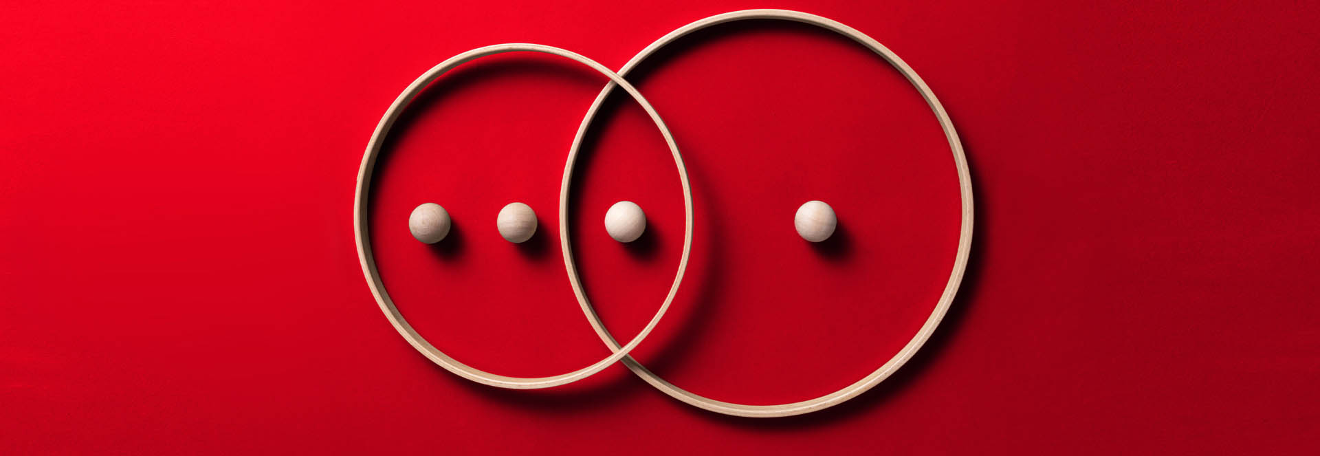 Photo depicting a Venn diagram made up of two overlapping circles with 5 dots between them: 3 dots in the left circle, 2 in the right, and one dot in the space where the 2 circles overlap.