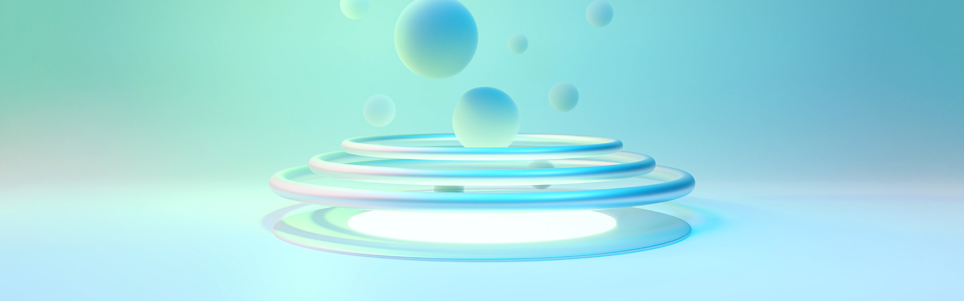 3-D orbs hover above rings against a blue background, serving as a representation of digital innovation.