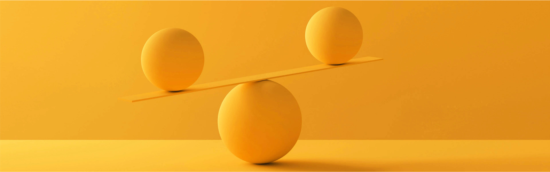 3D-rendering of two yellow spheres balancing