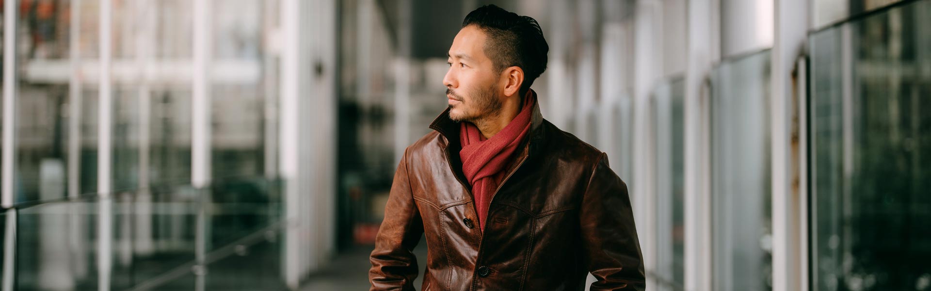 A man pauses to look to his right to focus on something offscreen.