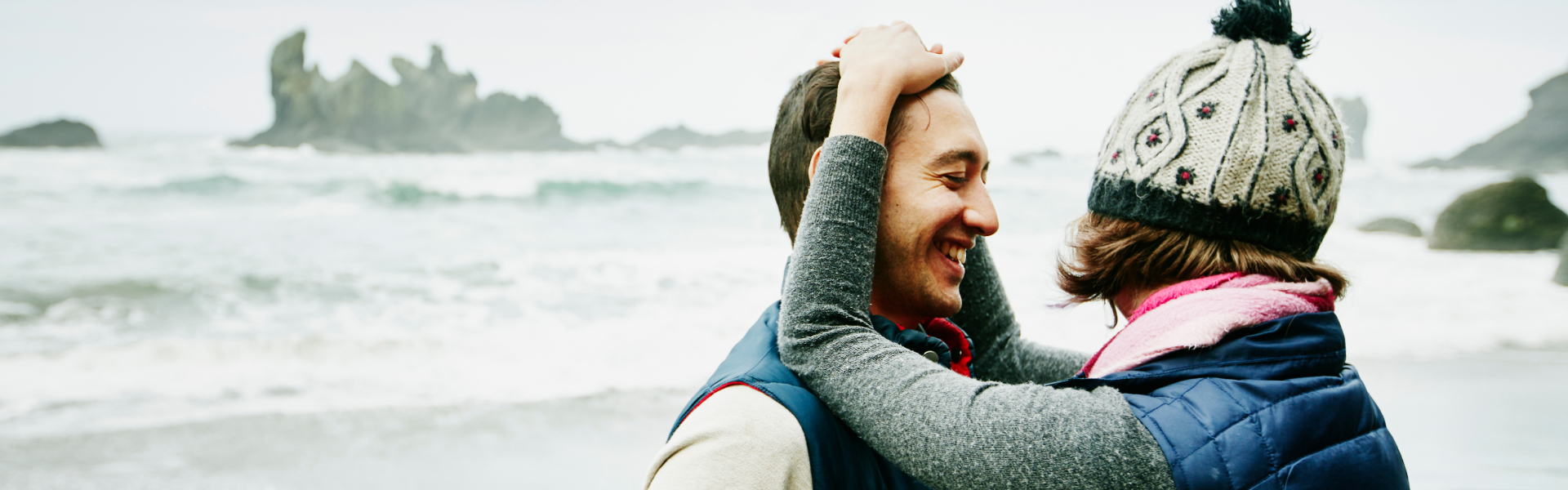 A woman is leaning against a man.