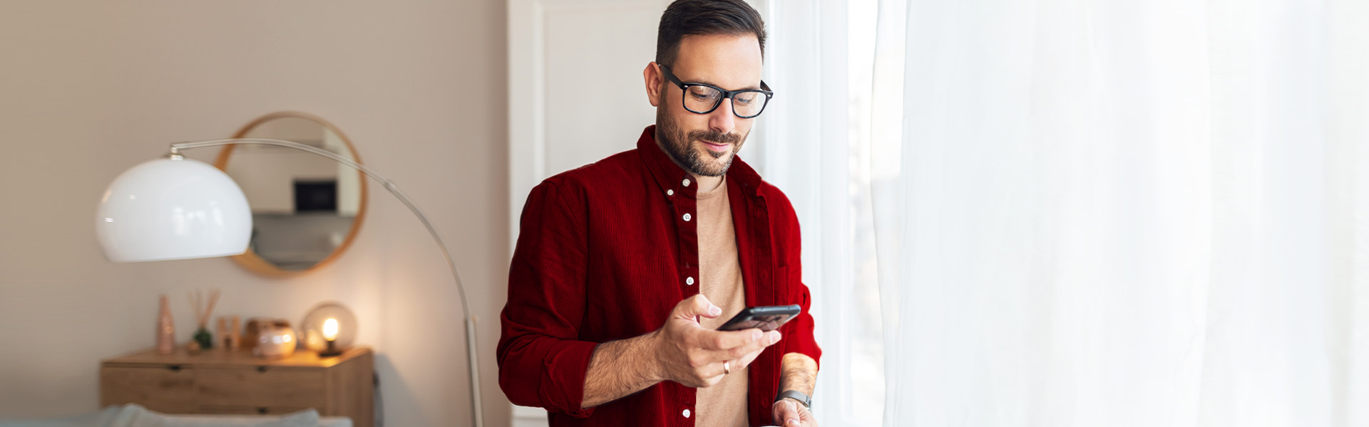 A man looking down on his phone.