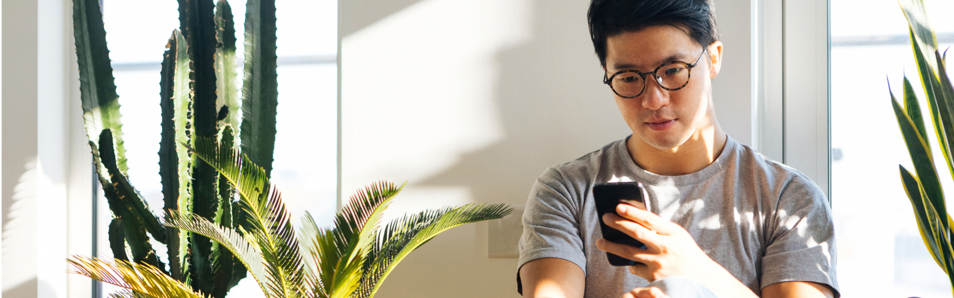 A man is looking at his smartphone.