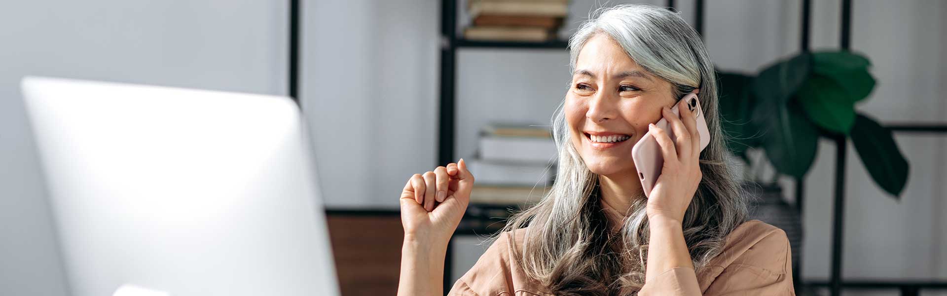 Woman smiling on phone.