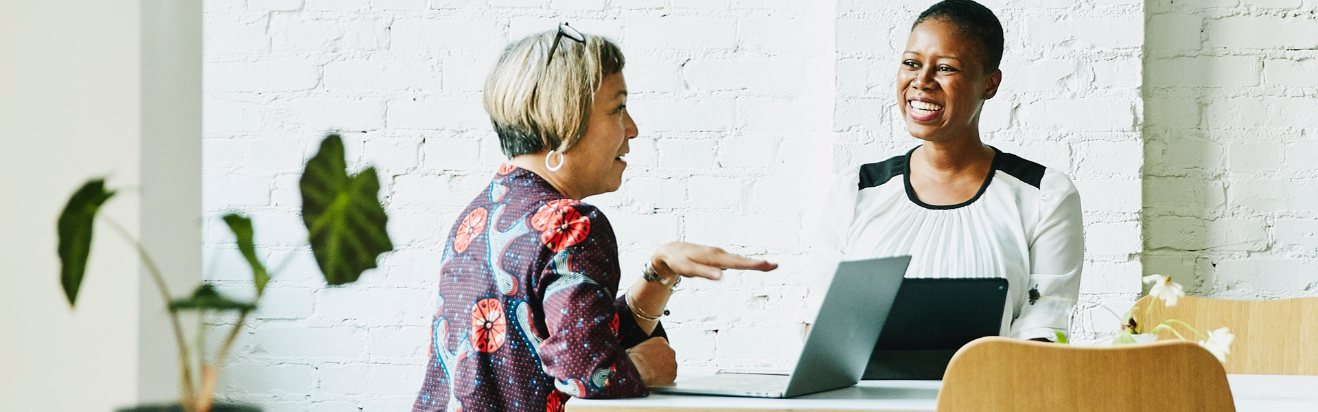 Two women are talking to each other.