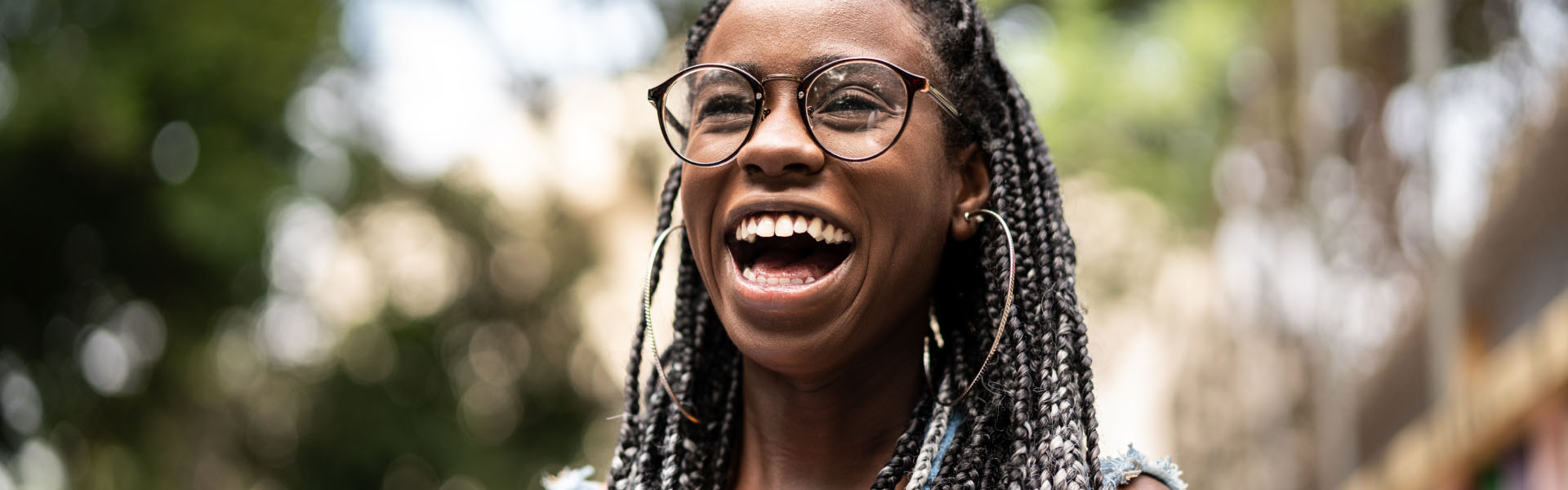 A young woman is laughing.