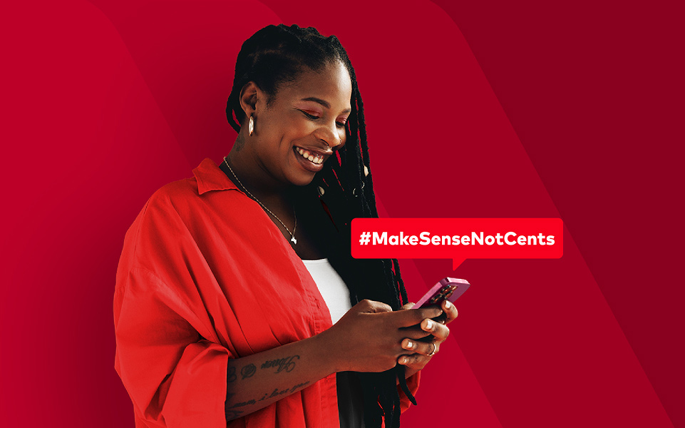 A woman holding a mobile phone against a red patterned background with #MakeSenseNotCents caption above the phone.