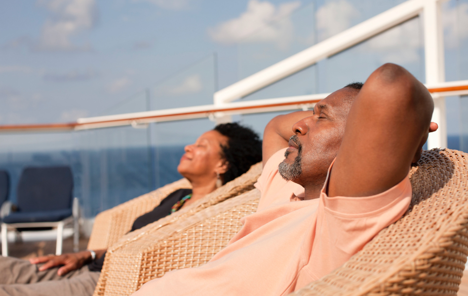A couple looking relaxed and reclining side by side