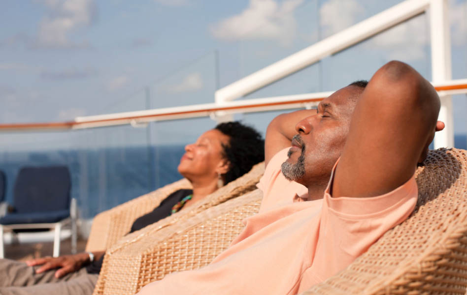 A couple looking relaxed and reclining side by side.