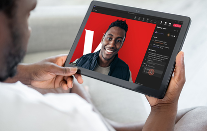 A man having a virtual meeting with his advisor. 