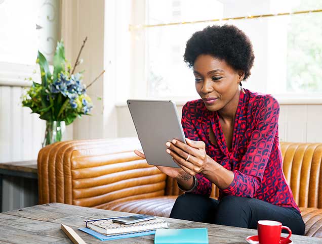 Women accessing her account on a tablet.