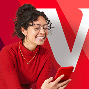 woman smiling at phone with vanguard logo