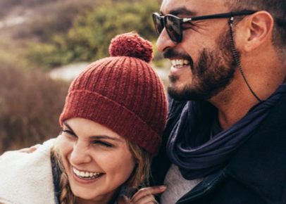  A man is embracing a woman leaning against him.