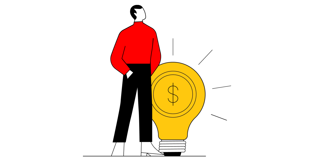 A man in a red shirt and black pants stands next to a large light bulb that has a dollar sign in the middle. the image represents the concept of having a great idea that could make money.