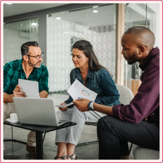 Woman talking to male advisors.